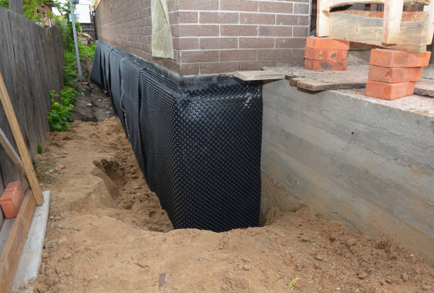 Happy homeowners after waterproofing job in Tuscarora